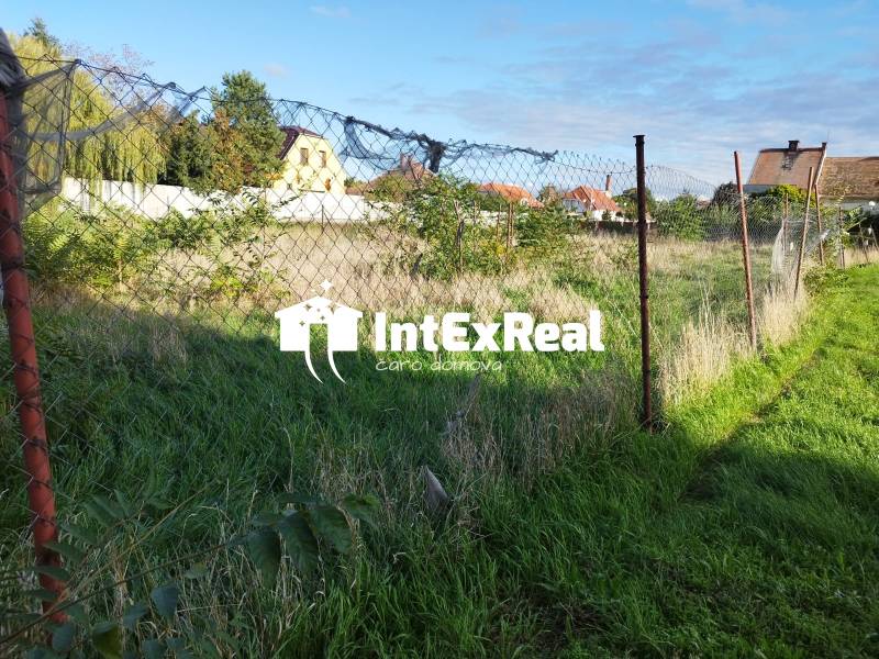 Na predaj pozemok v centre mesta Sládkovičovo, viac na: https://reality.intexreal.sk/